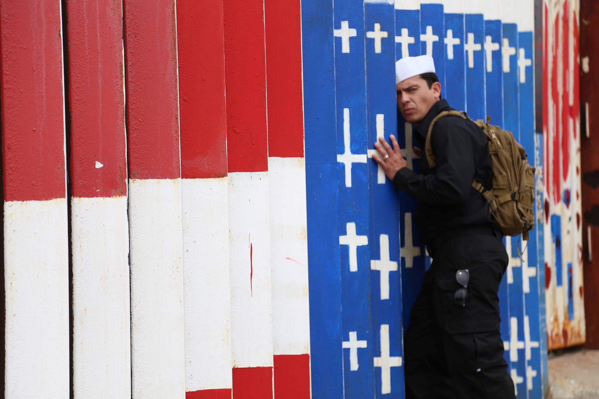 Alex Murillo at border wall in Friendship Park, Tijuana