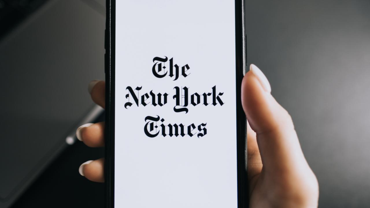 New York Times emblem on a person's phone