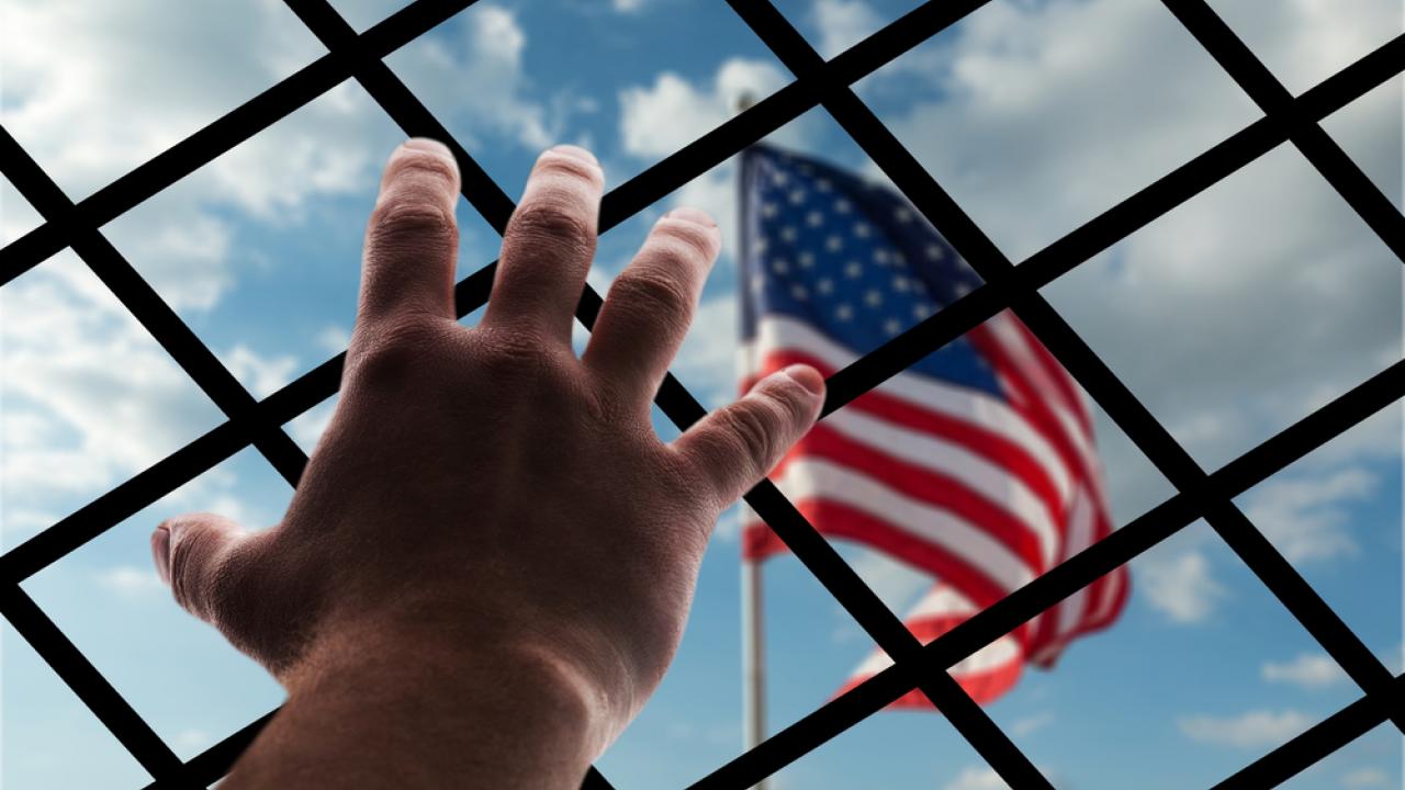 Hand Reaching for American Flag