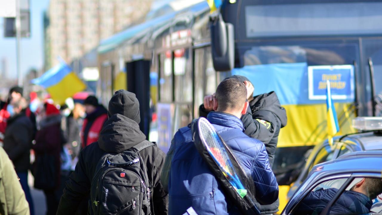 Ukrainian Refugees filing into a bus
