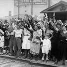 Relatives and friends wave goodbye to a train carrying 1,500 persons being expelled from Los Angeles back to Mexico on Aug. 20, 1931. Photo via NY Daily News Archive, Getty Images