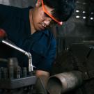 Immigrant doing mechanical engineering labor