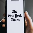 New York Times emblem on a person's phone